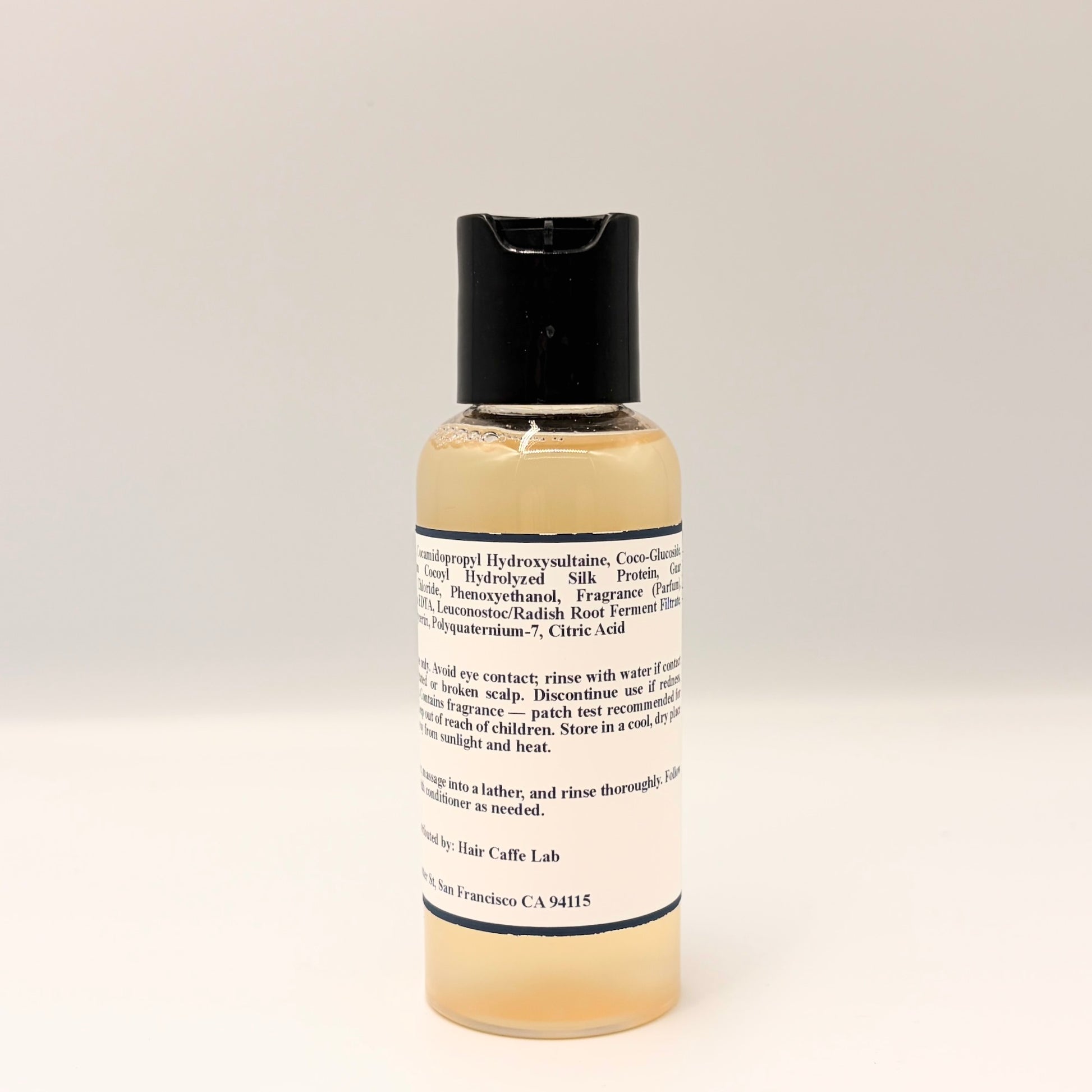 S-7 Daily Shampoo ingredient list close-up: sulfate-free formula with hydrolyzed silk protein