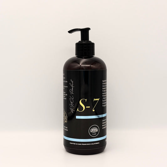 Hair Caffe Lab S-7 Daily Shampoo Standard Size, 16 fl oz / 473 mL amber pump bottle with gold S-7 wordmark, front view